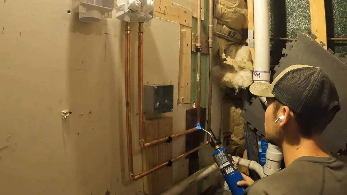 new supply and drain piping routed through open wall or utility space shown as hero overview for Plumber in Claremont, CA