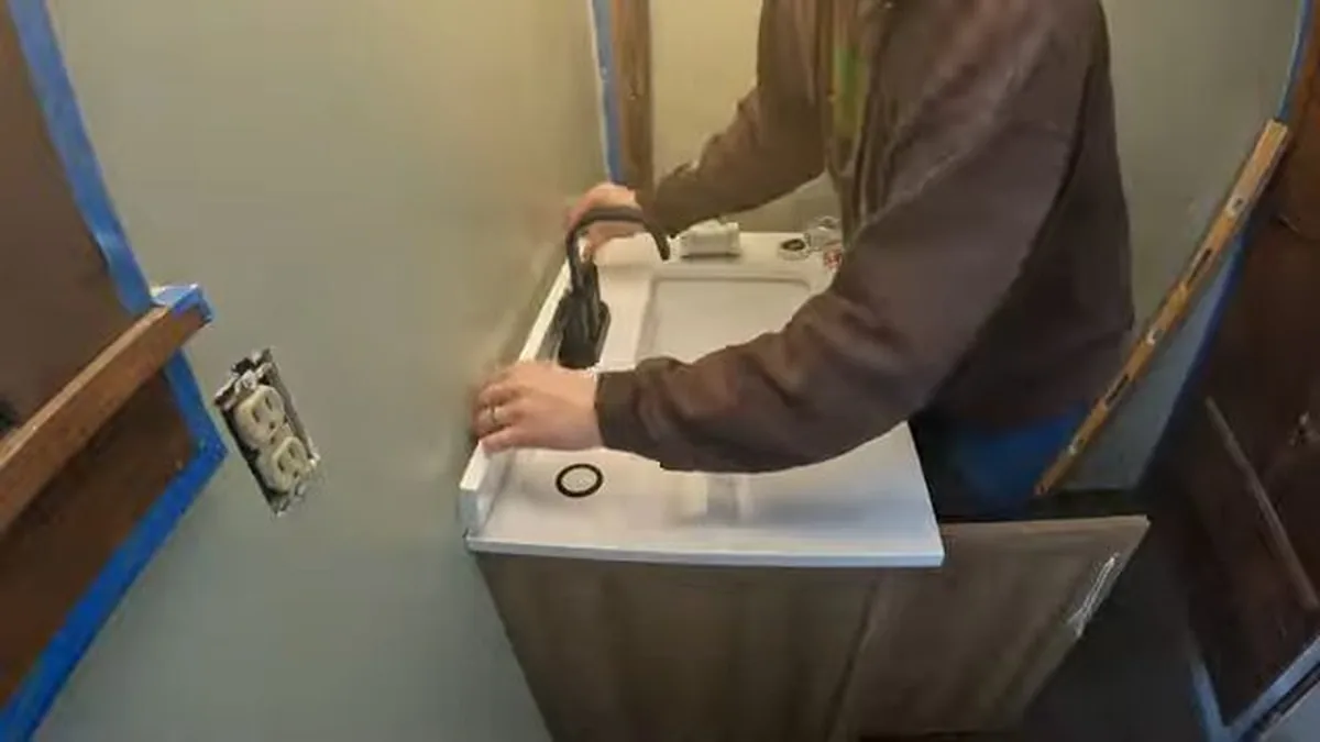 sink faucet or under-cabinet supply connection being serviced shown as hero overview for Faucet & Sink Repair in Glendora, CA