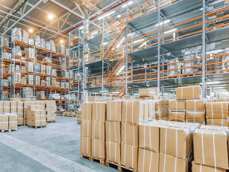 commercial storage area with overhead plumbing and boxed inventory shown as main detail for Glendora Plumbing Blog