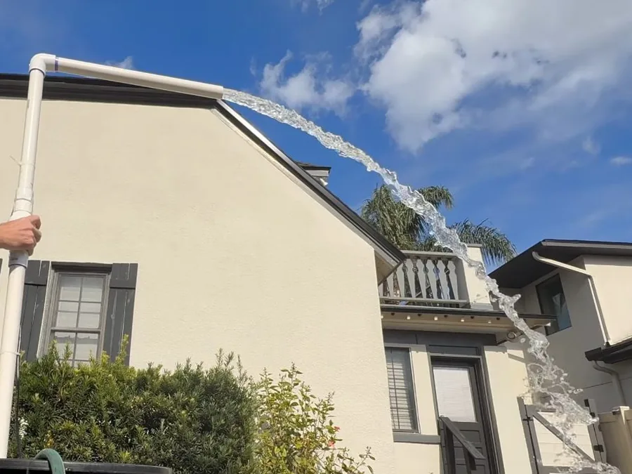 exterior home view with pump discharge equipment near the walkway shown as secondary detail for Plumbing Services in Glendora, CA