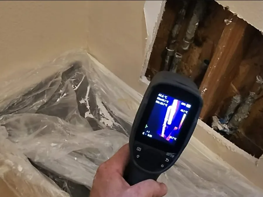 thermal imaging or electronic leak detection tool aimed at a wall opening shown as secondary detail for Leak Detection in Glendora, CA