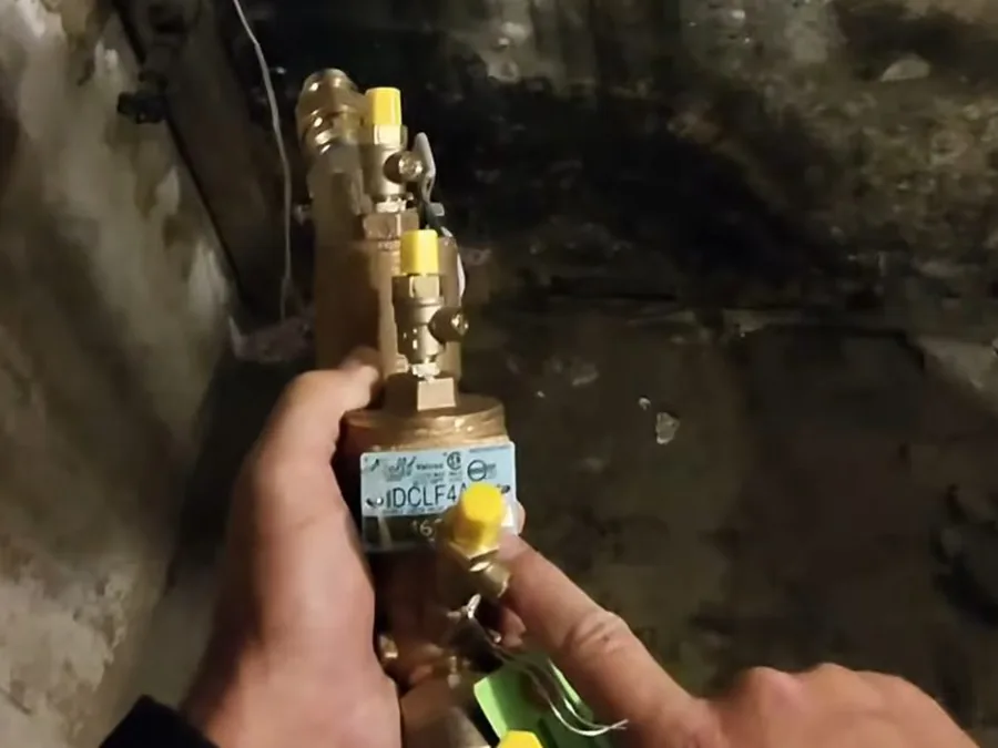 gas piping connection being checked near an appliance shown as secondary detail for Plumber in North Glendora, CA