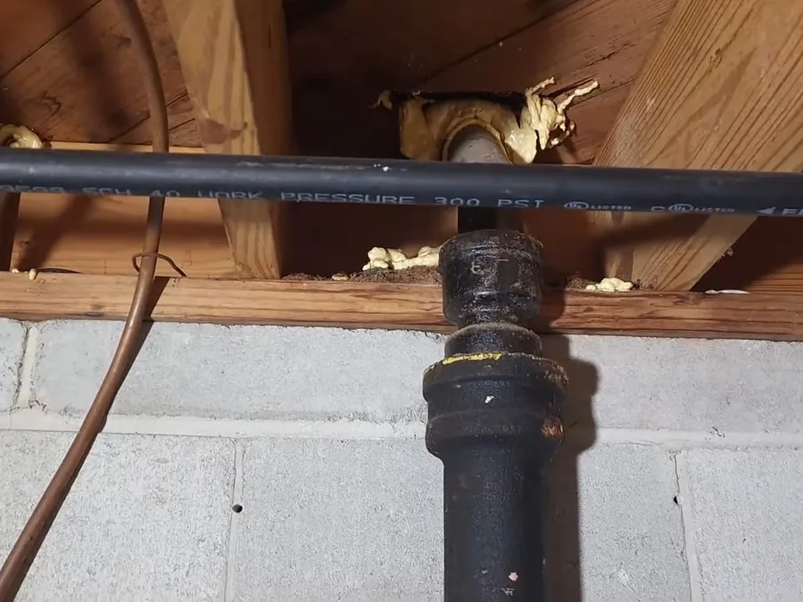 rusted cast iron pipe section with heavy interior buildup shown as secondary detail for Plumber in Pomona, CA