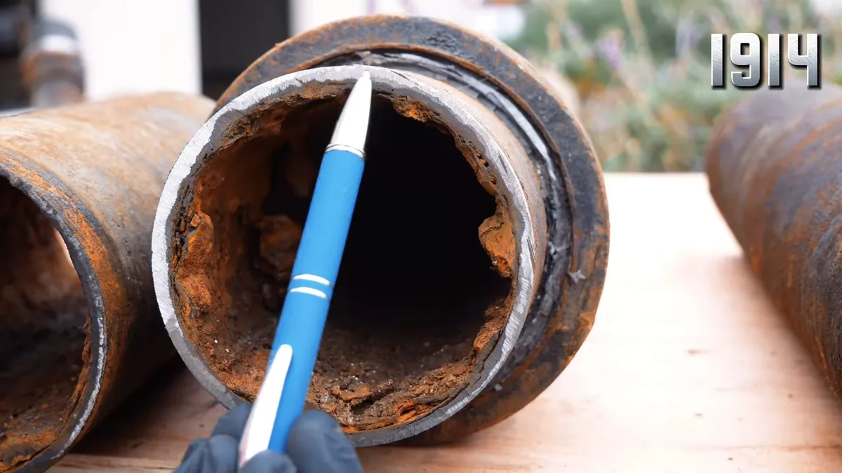 rusted cast iron pipe section with heavy interior buildup shown as hero overview for Plumber in Pomona, CA