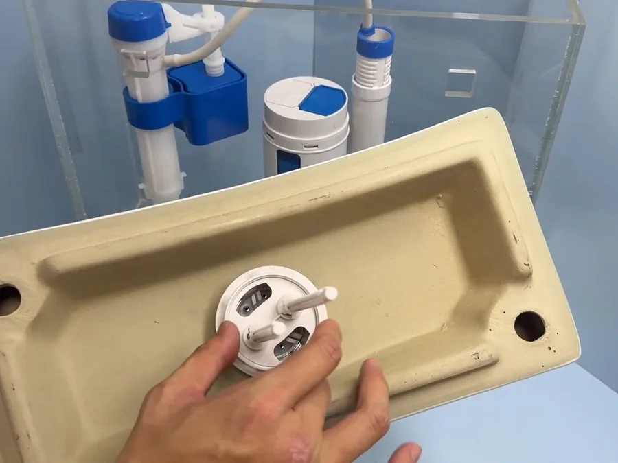 toilet tank repair parts being fitted inside the tank shown as secondary detail for Toilet Repair & Installation in Glendora, CA