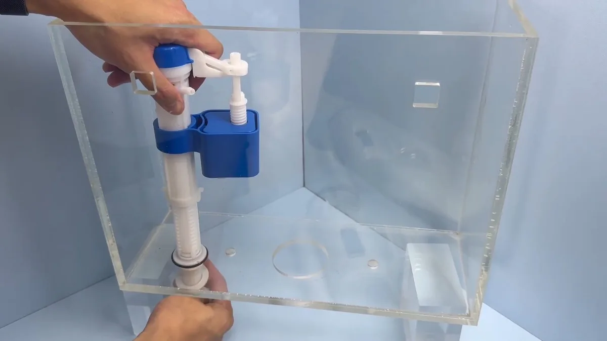toilet tank repair parts being fitted inside the tank shown as hero overview for Toilet Repair & Installation in Glendora, CA